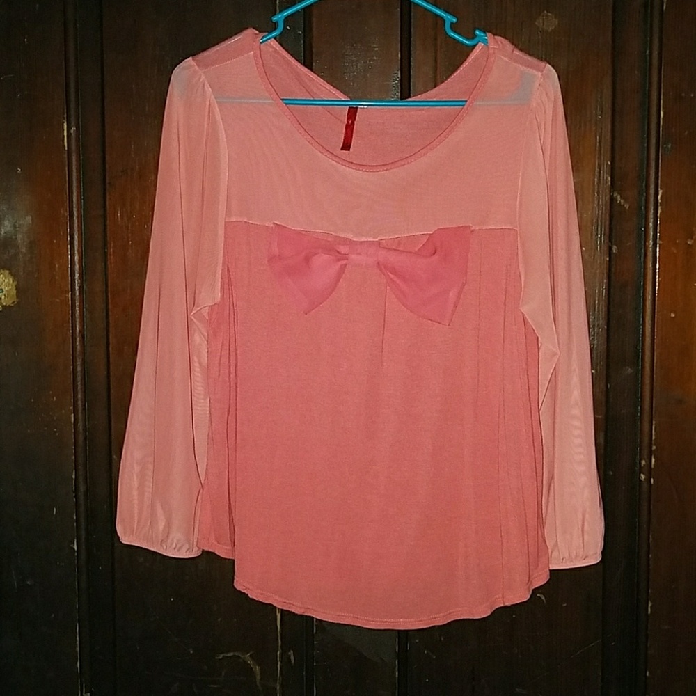 Coral bow shirt.